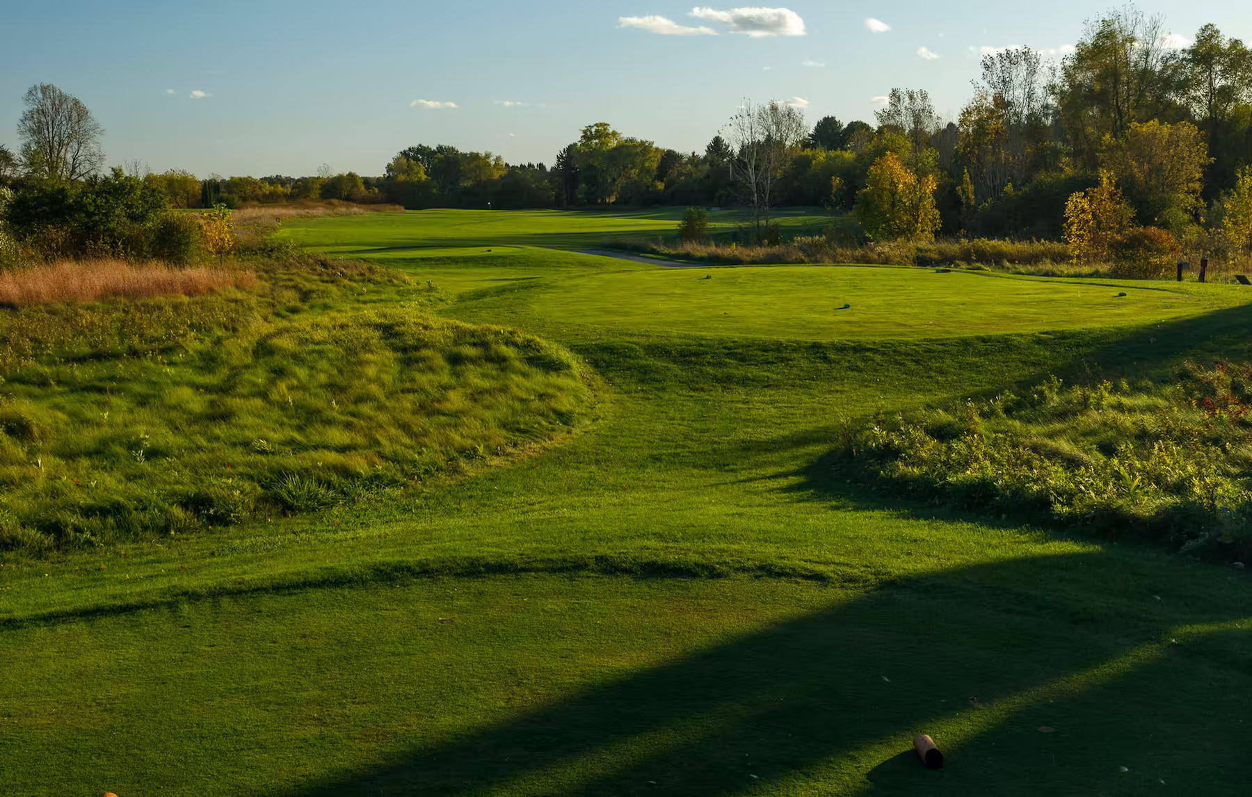 A golf course at sunset.